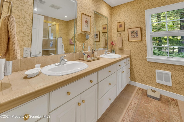 bathroom with tile patterned floors and vanity