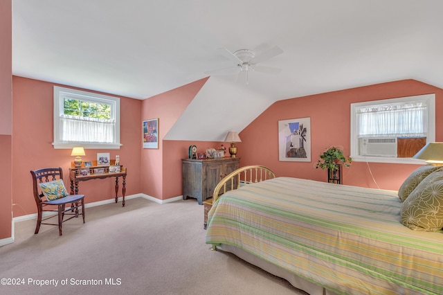 bedroom with ceiling fan, cooling unit, lofted ceiling, and multiple windows