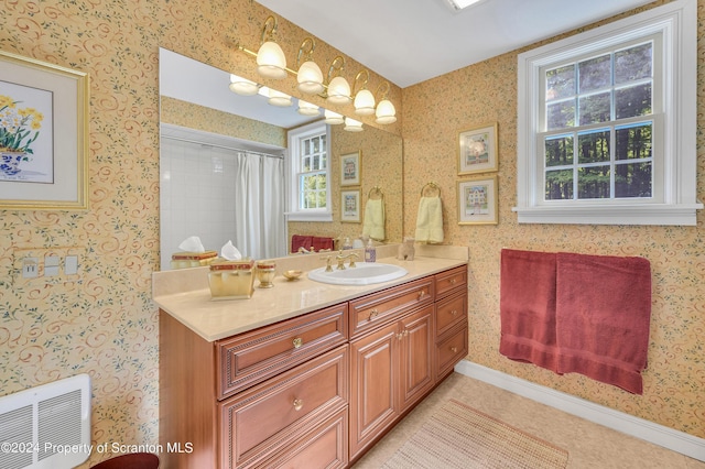 bathroom with a shower with curtain and vanity