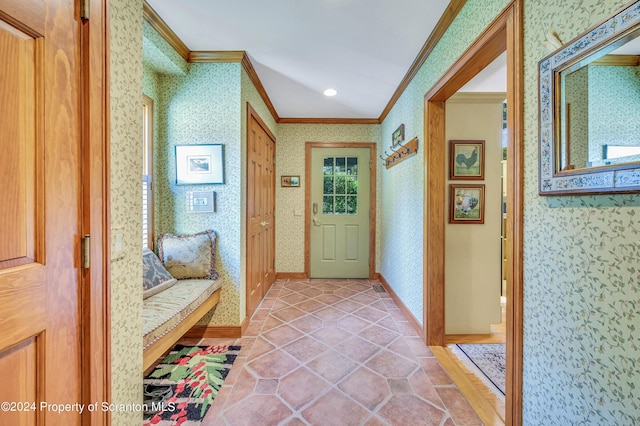 doorway featuring ornamental molding