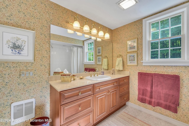 bathroom featuring tile patterned floors, heating unit, vanity, and walk in shower