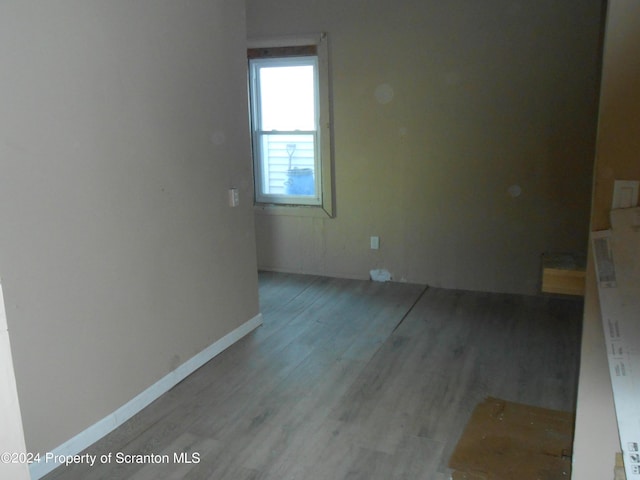 unfurnished room with hardwood / wood-style floors