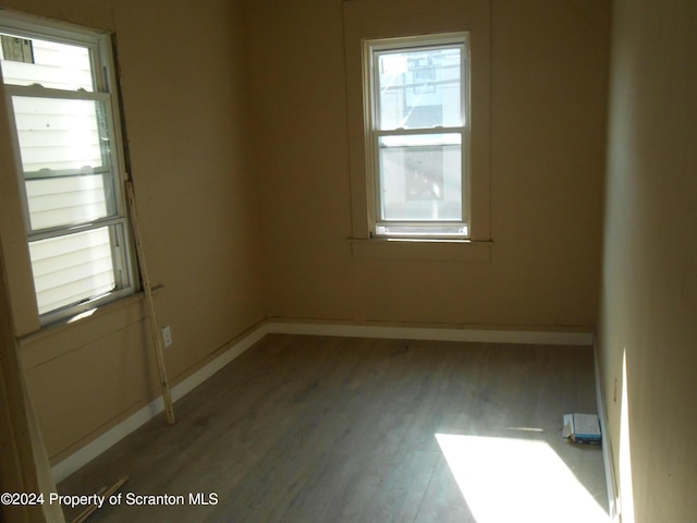 empty room with hardwood / wood-style floors