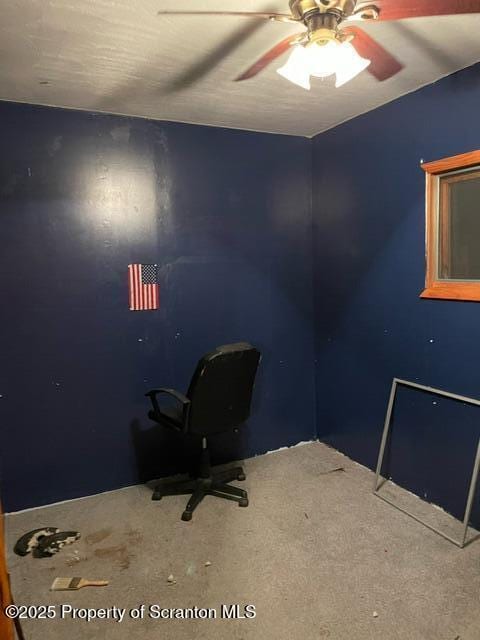 unfurnished office with ceiling fan