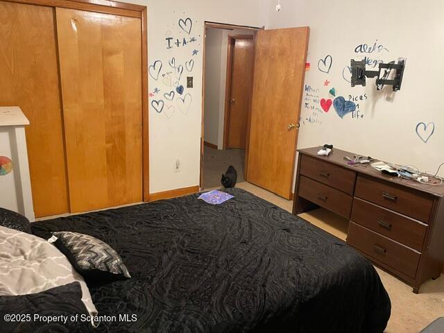 bedroom featuring baseboards