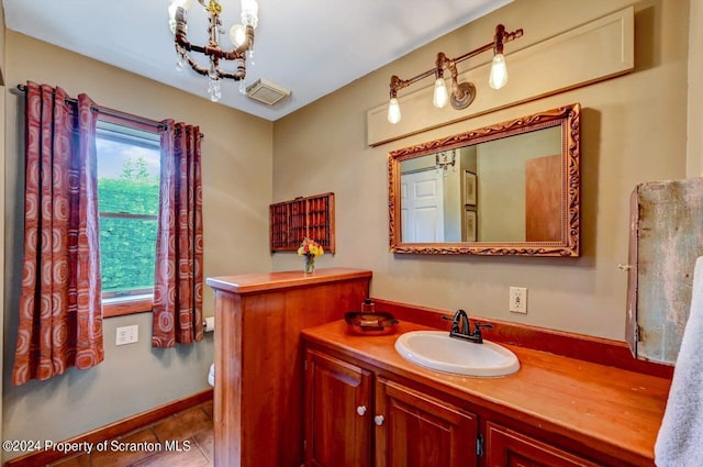 bathroom with tile patterned flooring and vanity