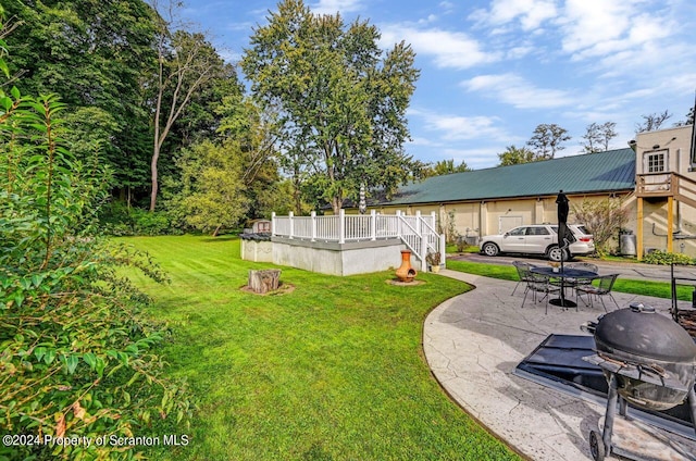 view of yard with a patio area and a deck