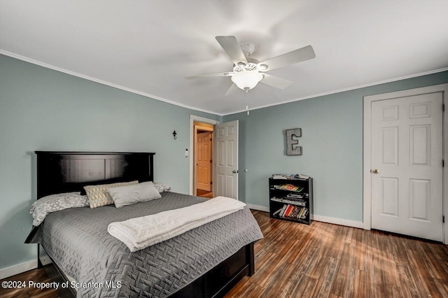 bedroom with dark hardwood / wood-style floors, ceiling fan, and crown molding