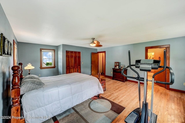 bedroom with hardwood / wood-style floors and ceiling fan