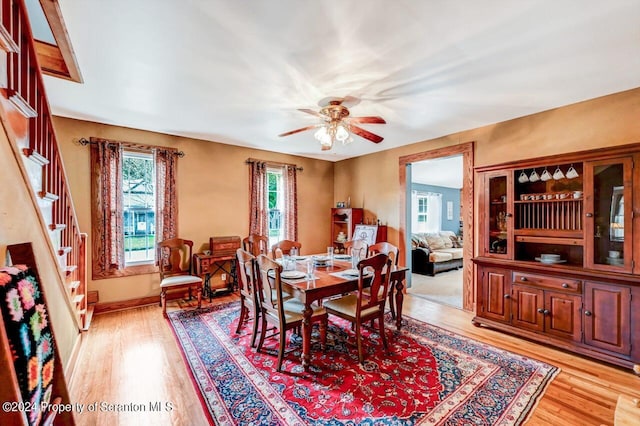 dining area featuring ceiling fan and light hardwood / wood-style floors