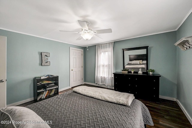 bedroom featuring ceiling fan, dark hardwood / wood-style flooring, and crown molding