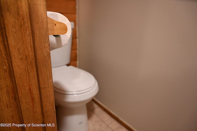 bathroom with tile patterned flooring and toilet