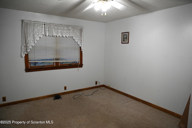 empty room featuring carpet, a textured ceiling, and ceiling fan