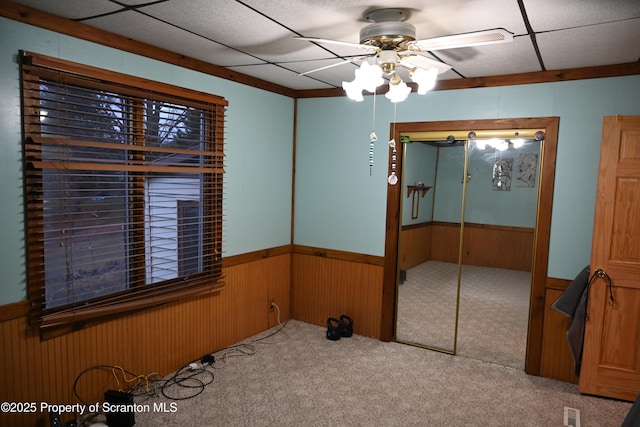 carpeted empty room with ceiling fan