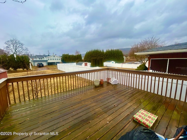 wooden deck featuring fence