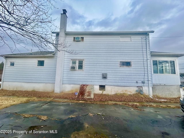 rear view of house with a chimney