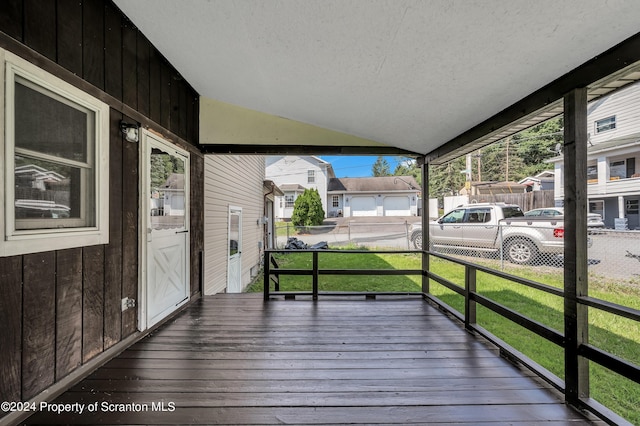 wooden deck with a yard