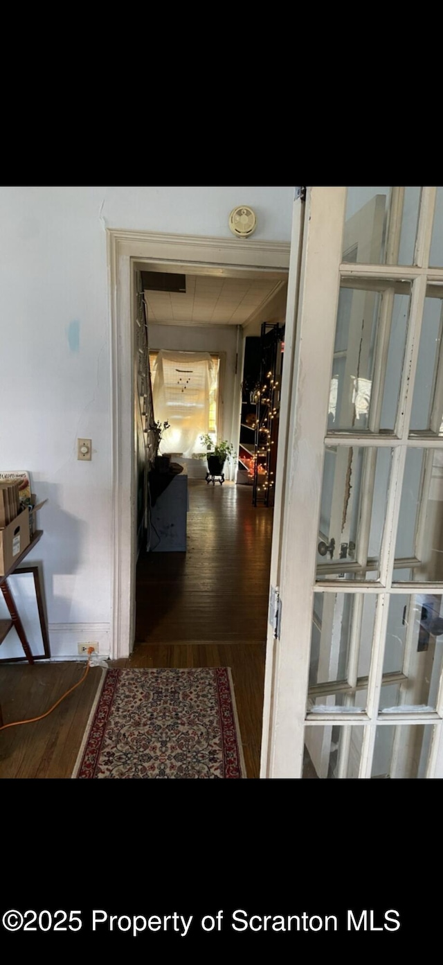 hallway with wood finished floors