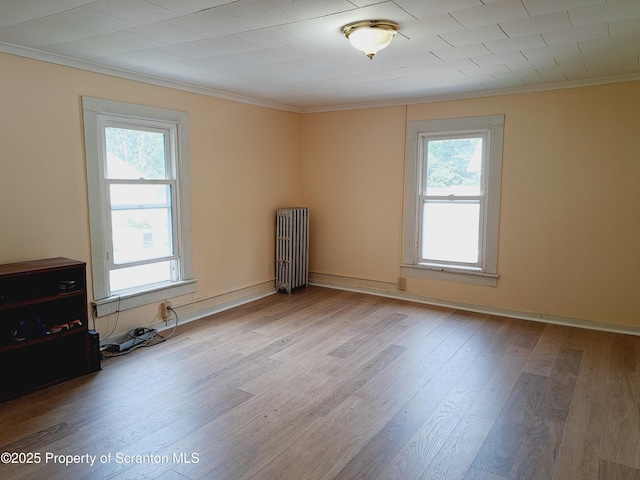 2127 Price St, Scranton, PA 18504 - unfurnished room featuring radiator, crown molding, and wood finished floors