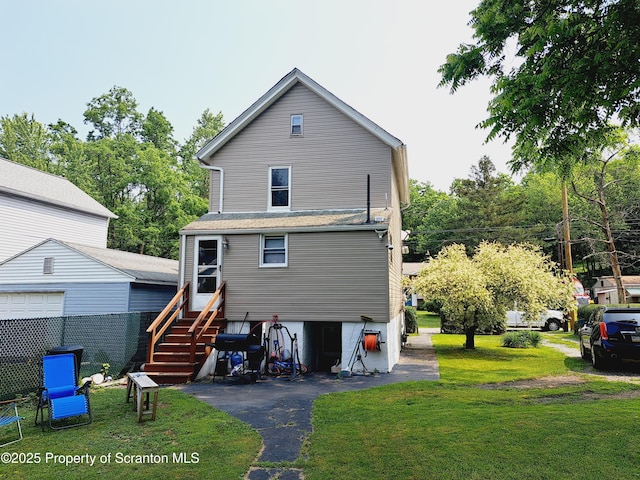 2127 Price St, Scranton, PA 18504 - back of property with a yard and entry steps