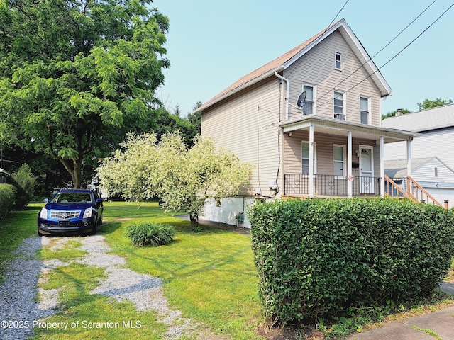 2127 Price St, Scranton, PA 18504 - view of front of property featuring covered porch and a front lawn