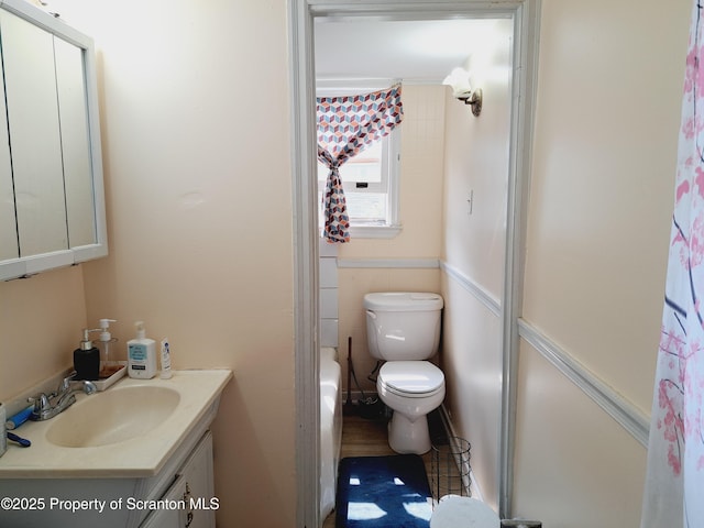 2127 Price St, Scranton, PA 18504 - full bath featuring vanity, curtained shower, and a wainscoted wall