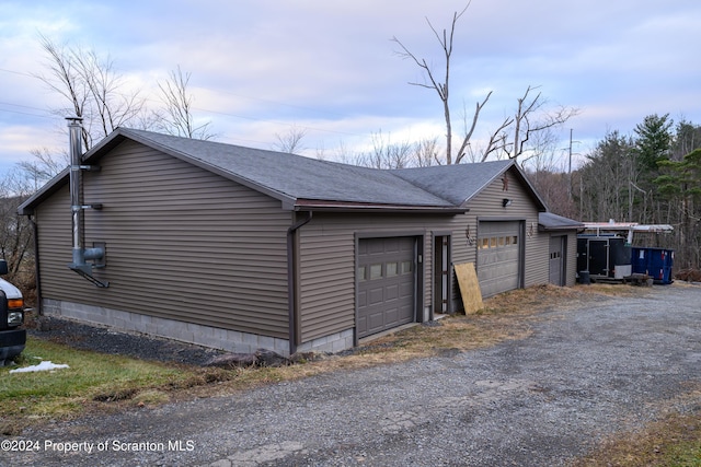 view of side of property featuring a garage