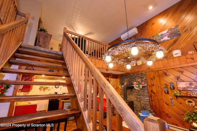 staircase with wood walls