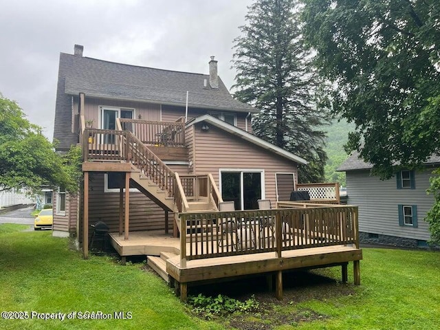 121 Burcher Ave, South Abington Twp, PA 18411 - rear view of property with a chimney, a deck, and a lawn