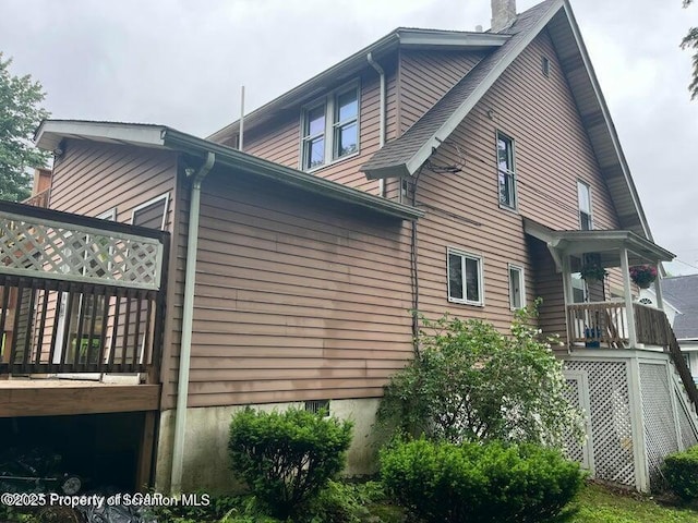 121 Burcher Ave, South Abington Twp, PA 18411 - view of property exterior with a chimney