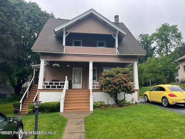 121 Burcher Ave, South Abington Twp, PA 18411 - view of front of property featuring a porch, stairway, a front yard, and a shingled roof