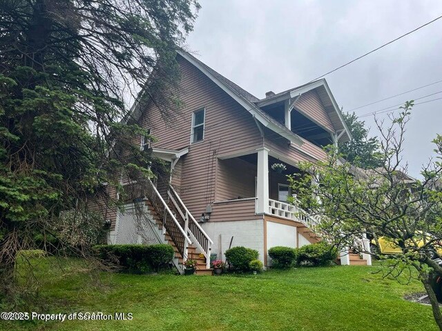 121 Burcher Ave, South Abington Twp, PA 18411 - view of property exterior with stairway and a yard