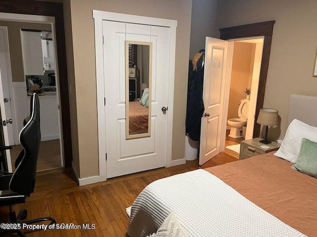 121 Burcher Ave, South Abington Twp, PA 18411 - bedroom featuring hardwood / wood-style flooring, baseboards, a closet, and connected bathroom