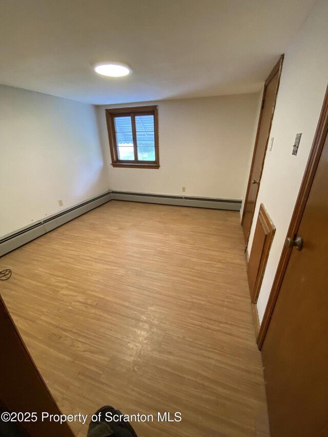 spare room featuring light hardwood / wood-style floors