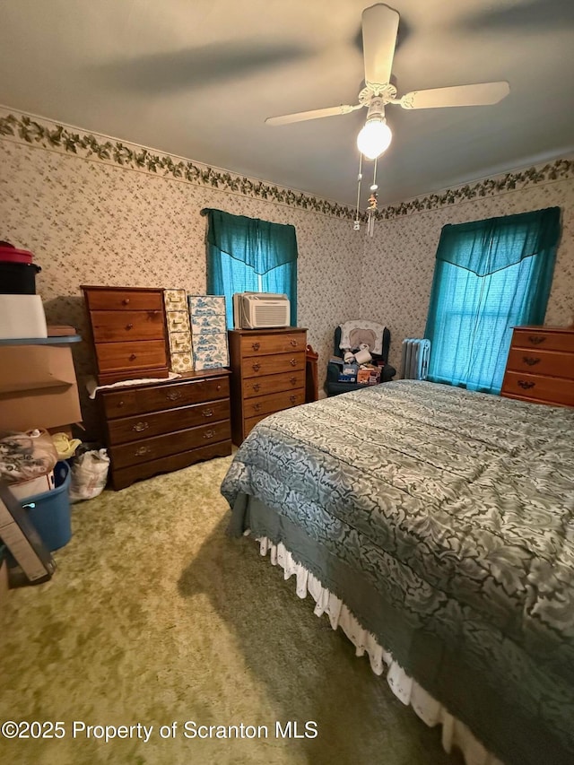carpeted bedroom featuring ceiling fan and wallpapered walls