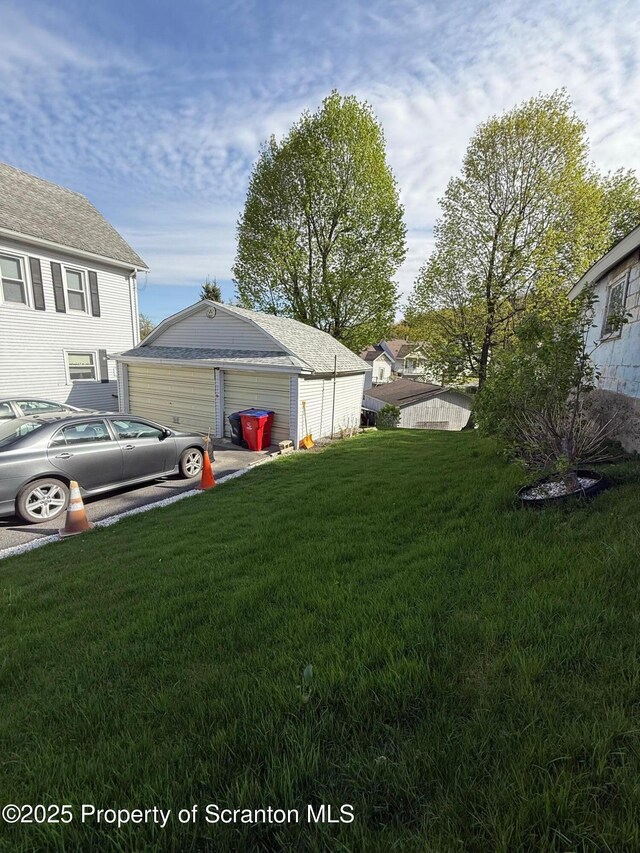 view of yard featuring a garage