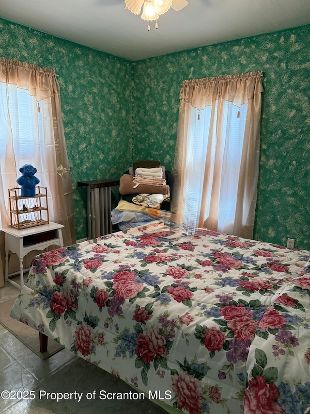 bedroom featuring wallpapered walls
