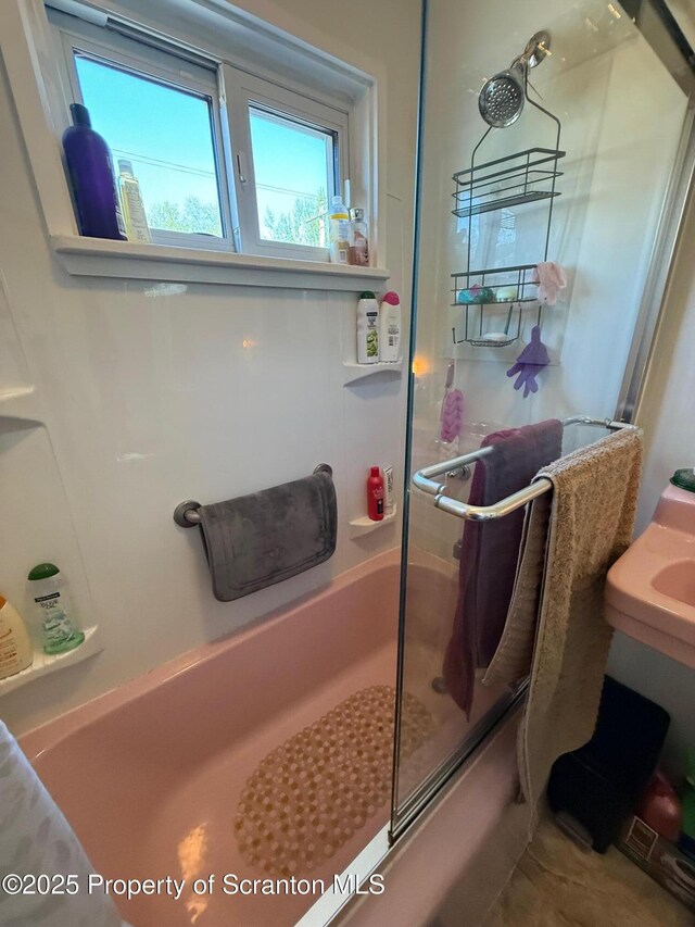 full bathroom with a shower with door