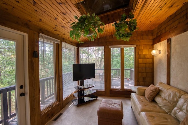 sunroom / solarium featuring wood ceiling