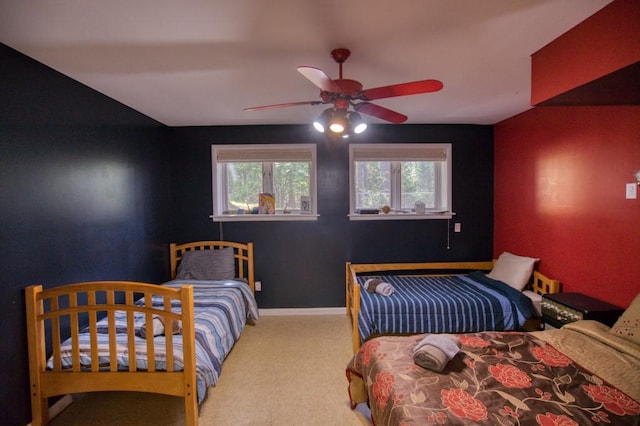 carpeted bedroom with ceiling fan