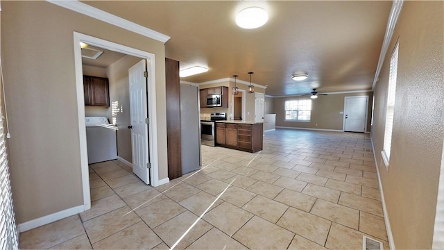 kitchen featuring ceiling fan, washer / dryer, stainless steel appliances, light tile floors, and crown molding