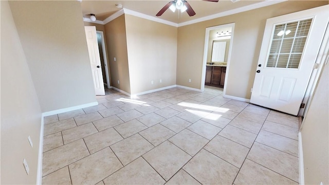 unfurnished room with light tile floors, crown molding, and ceiling fan