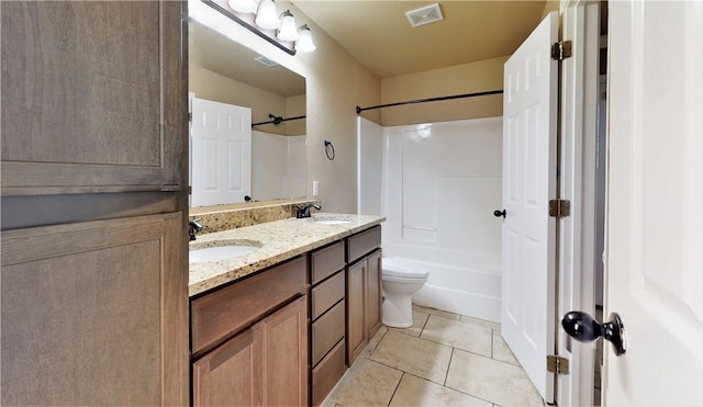 full bathroom featuring dual sinks, tile flooring, washtub / shower combination, toilet, and large vanity