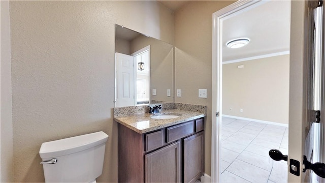 bathroom with crown molding, oversized vanity, toilet, and tile flooring