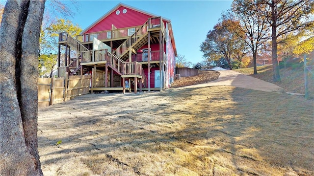 rear view of property with a wooden deck