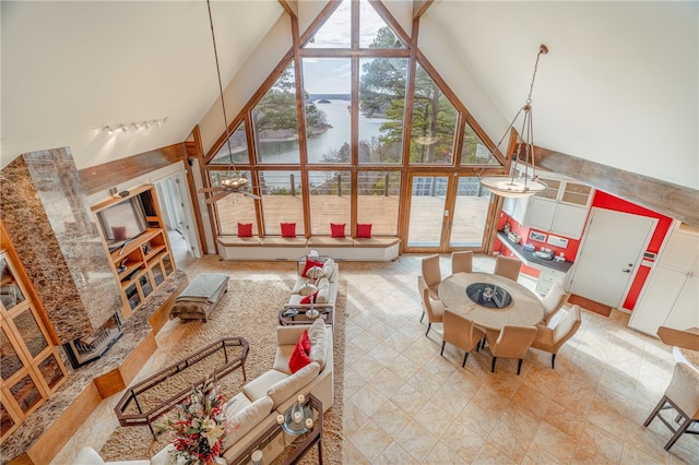 18515 Dream Catcher, Garfield, AR 72732 - tiled living room with high vaulted ceiling, a water view, a wealth of natural light, and beamed ceiling