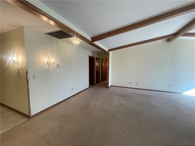 unfurnished room featuring light colored carpet and vaulted ceiling with beams