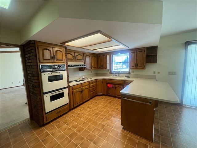 kitchen featuring light tile flooring, white appliances, sink, and fume extractor