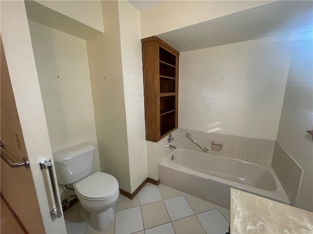 bathroom with a washtub, toilet, and tile flooring