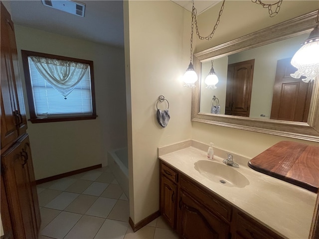 bathroom featuring bathtub / shower combination, vanity, and tile flooring